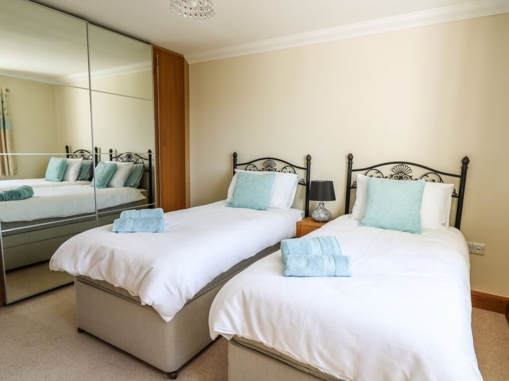 Large holiday accommodation twin bedroom