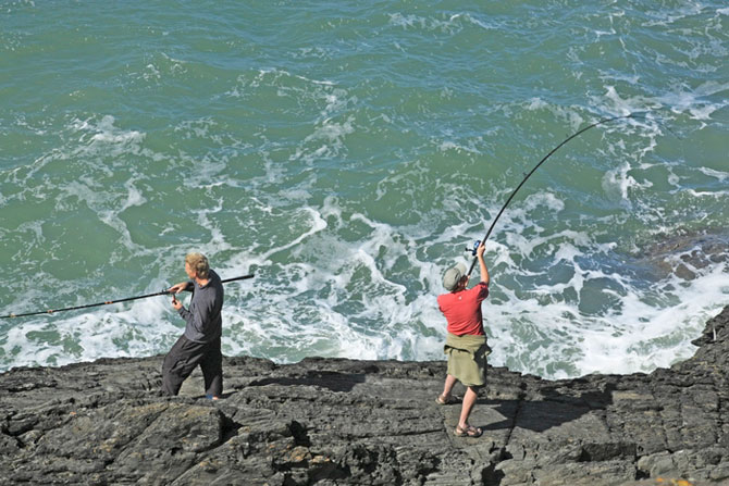 Sea Fishing from rocks at Mwnt Cardigan Bay by Janet Baxter